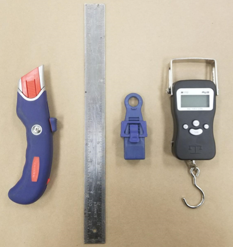 Utility knife and elements to test a waterproofing tape bond.png